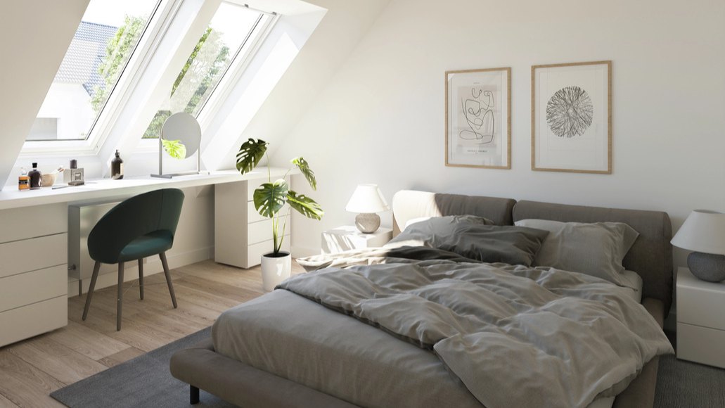 Pièce sous combles éclairée par des fenêtres de toit VELUX