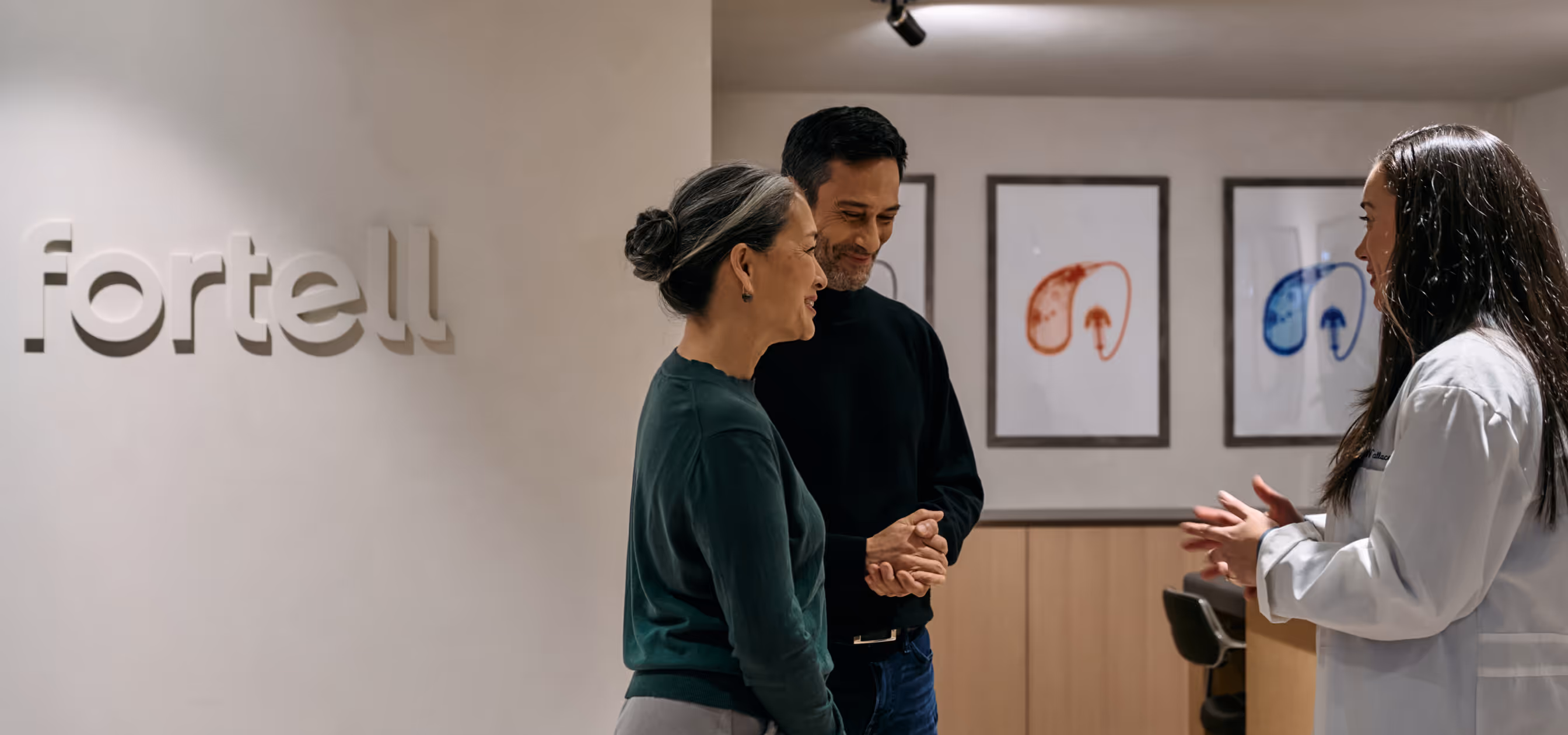 Image of two patients interacting with a Fortell audiologist in the NYC clinic.