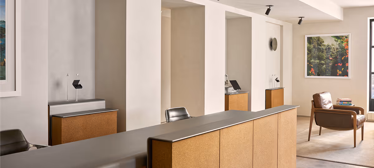 Display banner showing patients interacting with staff at the NYC clinic.