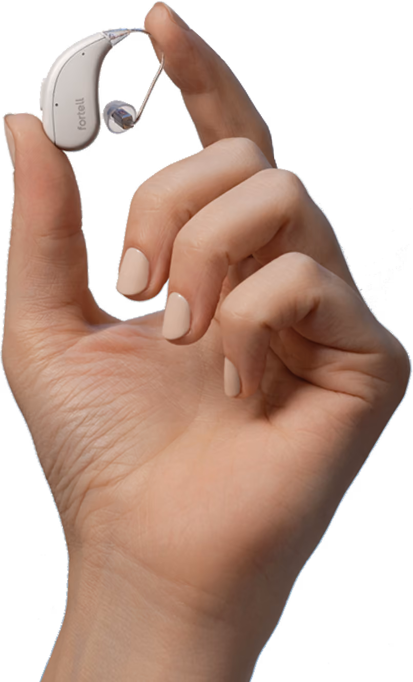 Hand holding a single Fortell hearing aid between two fingers.