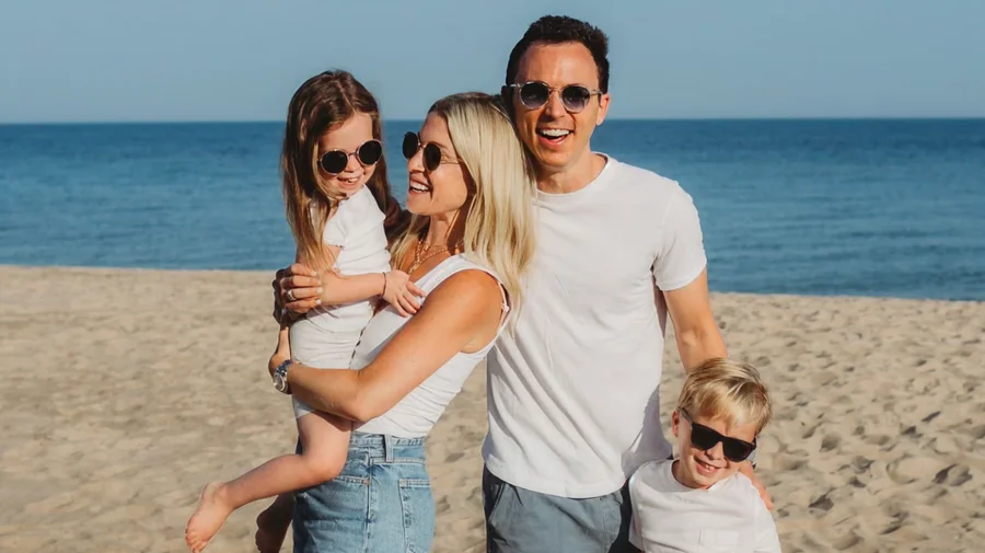 Jon with his family on a beach