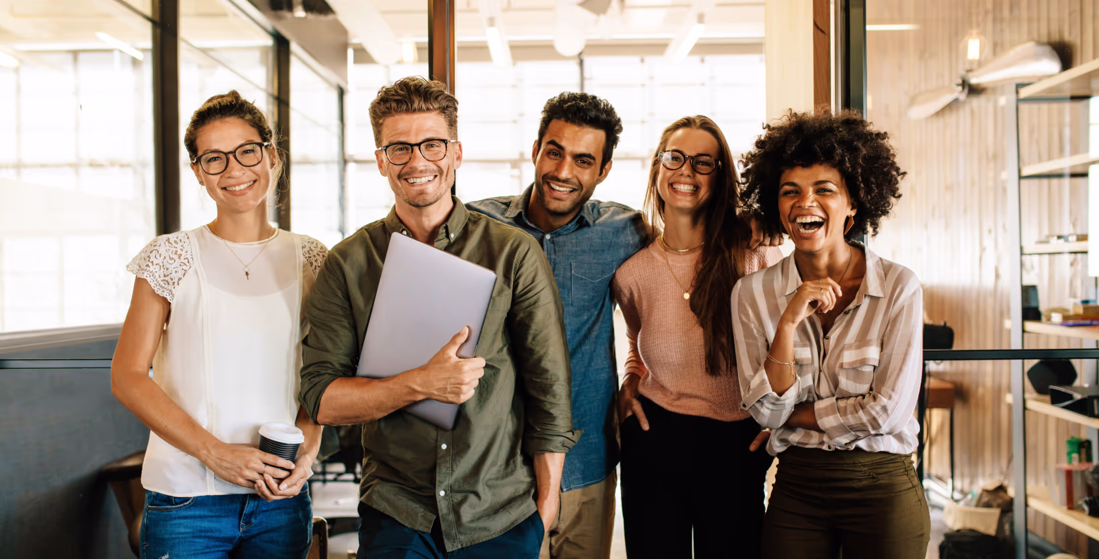 Group of diverse team members, powering Points at Work solutions.