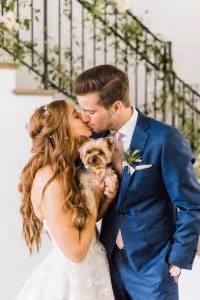 Brook and her husband holding their yorkie, Kaia.