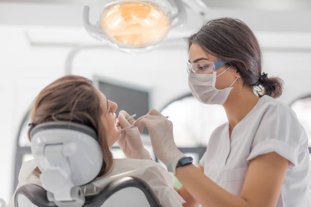 54,800+ Dentist Working Stock Photos, Pictures & Royalty-Free Images - iStock | Dentist working on patient, Dentist working on teeth, Male dentist working
