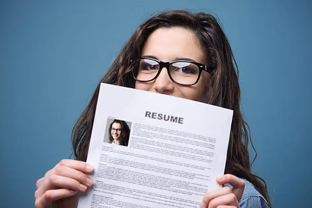 Hygienist holding resume, Person holding resume, Woman holding resume