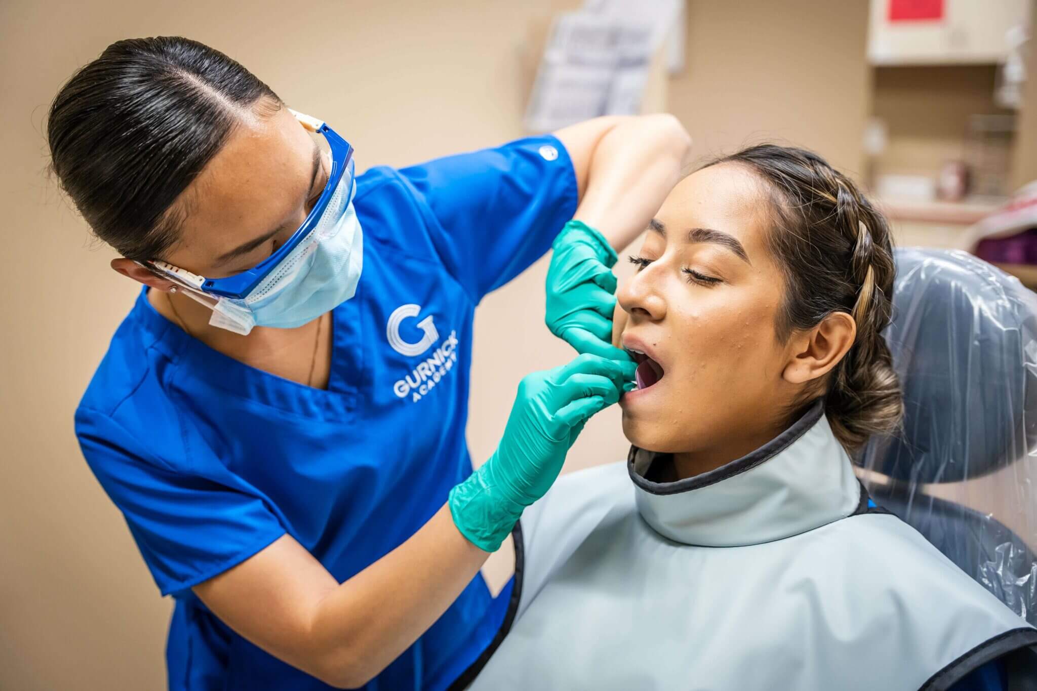 Dental Assistant Working on Patient.