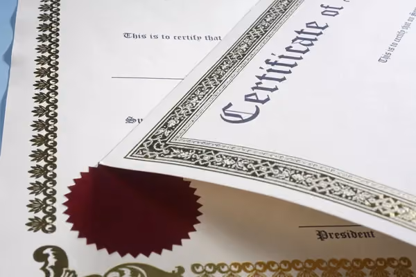 Certificates on table.