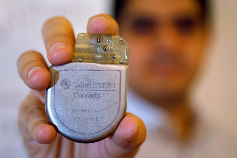Massachusetts Institute of Technology researcher and graduate student Haitham Al-Hassanieh holds one of the Medtronic heart defibrillators he successfully hacked, at MIT in Cambridge