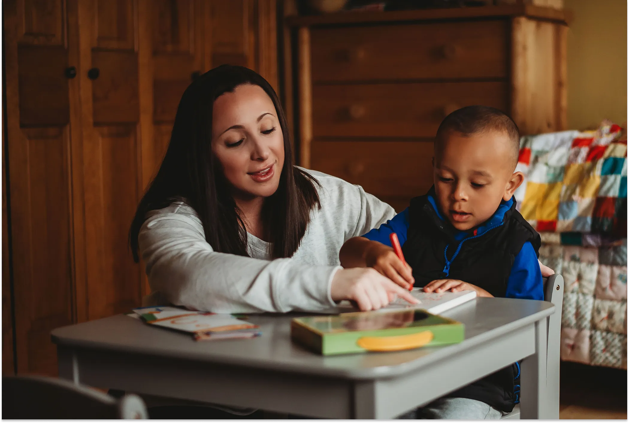 Sadie Fullam providing speech therapy to a young child in a calm, supportive setting at Speech and Language Nook.
