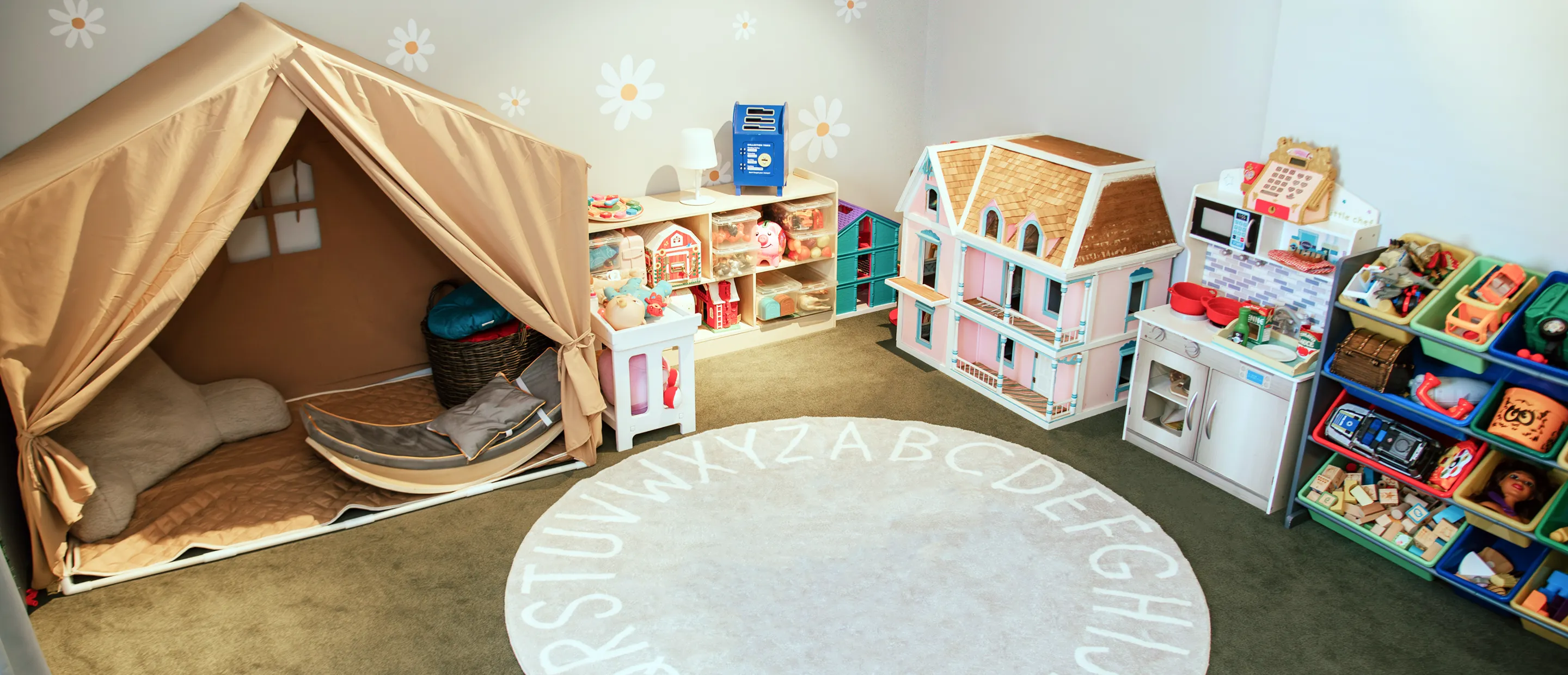 Sadie Fullam with a parent and two children, welcoming families to Speech and Language Nook, a supportive center for speech and educational services.