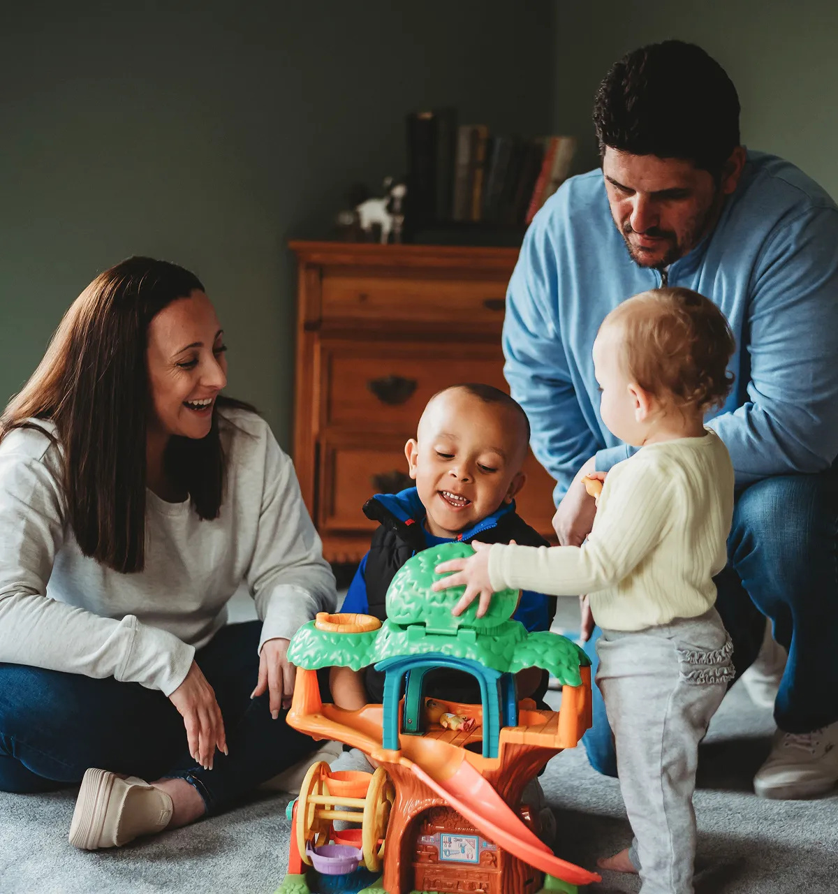 Sadie Fullam consulting with a parent and two children, providing personalized educational guidance and support.