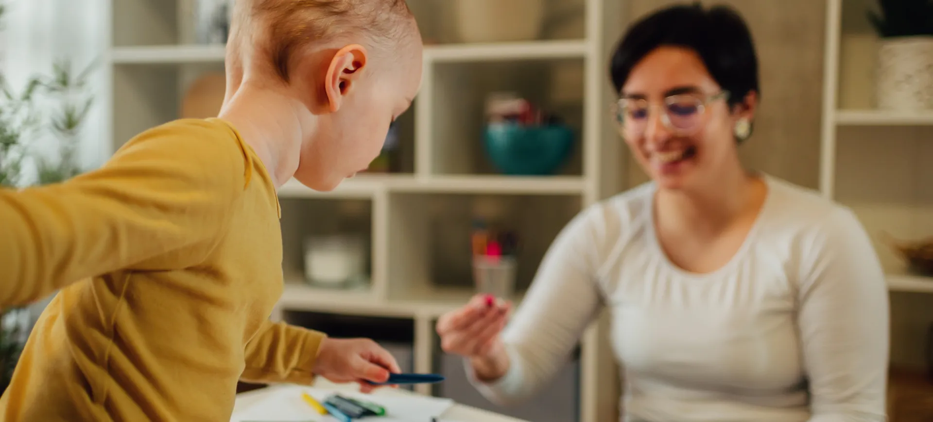 Image of a child interacting with an educational consultant.