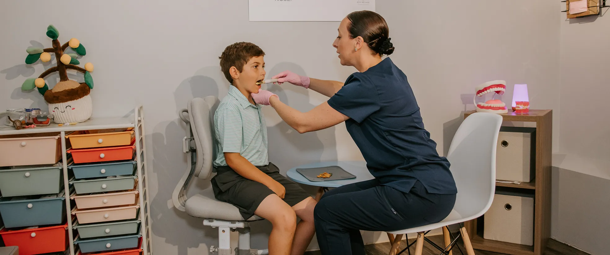 Dr. Sadie Benoit Fullam with a patient during Orofacial Myofunctional Therapy
