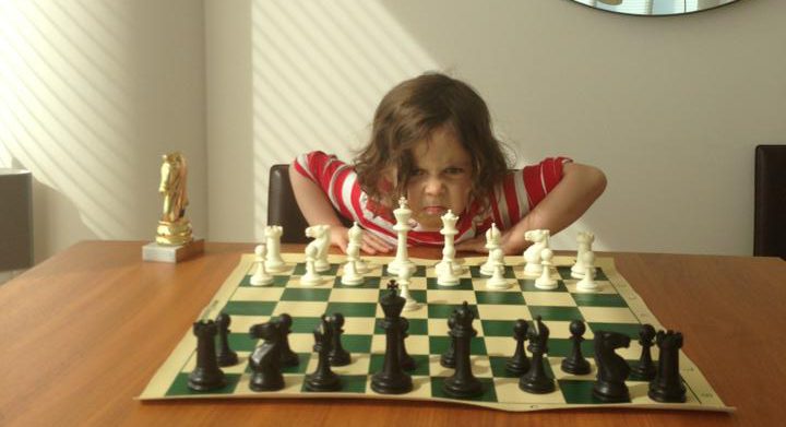 kid playing chess 