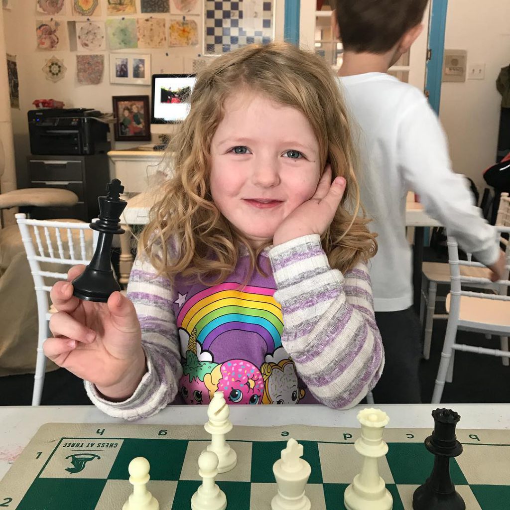 kid playing chess 