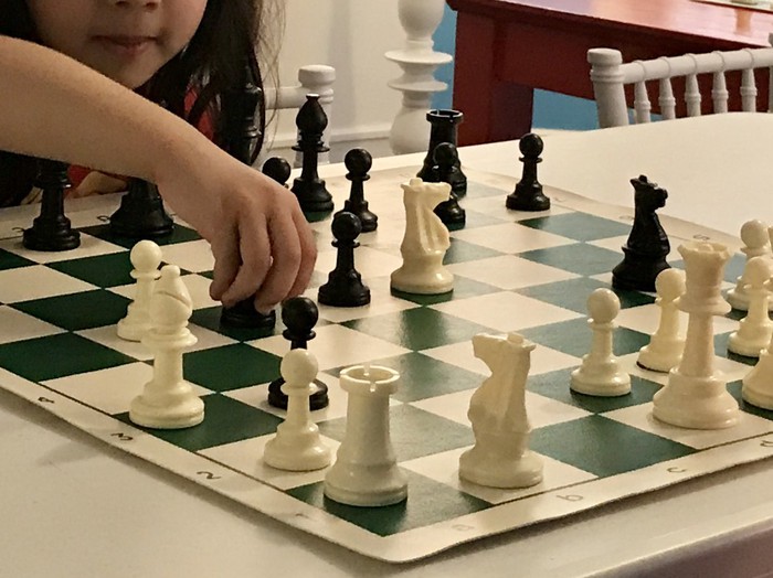 kid playinh chess
