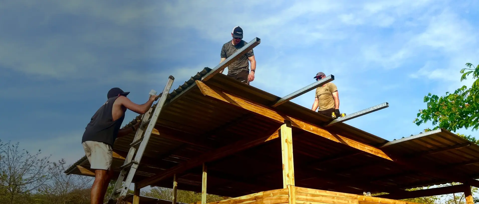 people on roof building