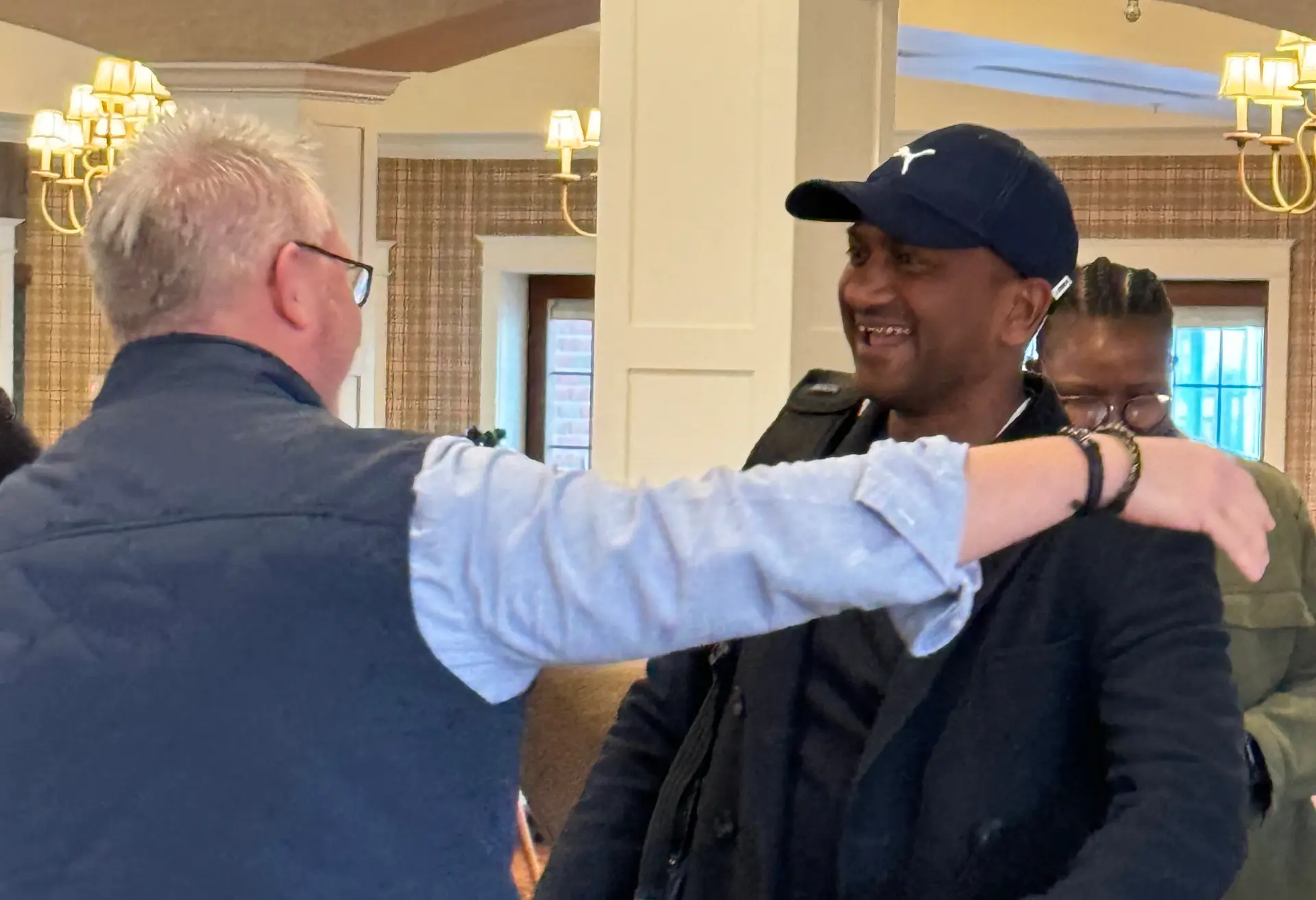 branches mentor offering hug to member