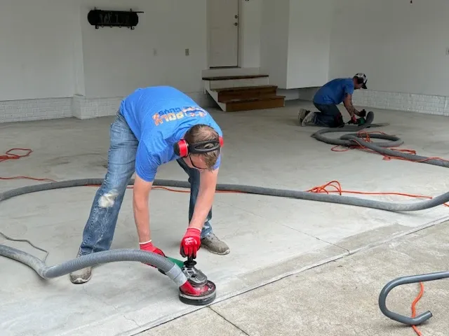 working on floor coating garage