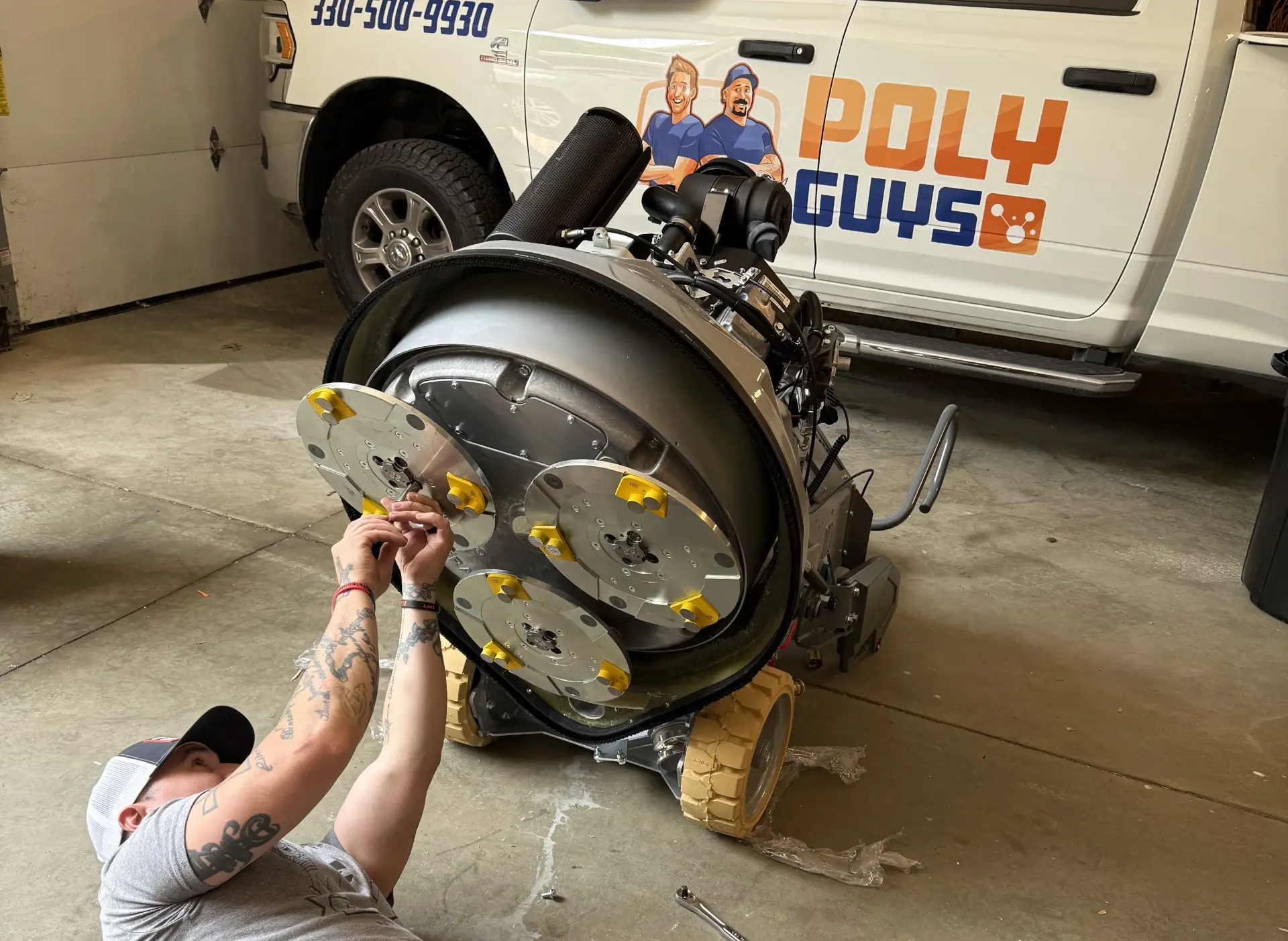 working on the bottom of the mobile grinder