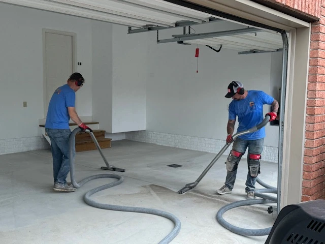 polyguys workers sucking up dirt from floor