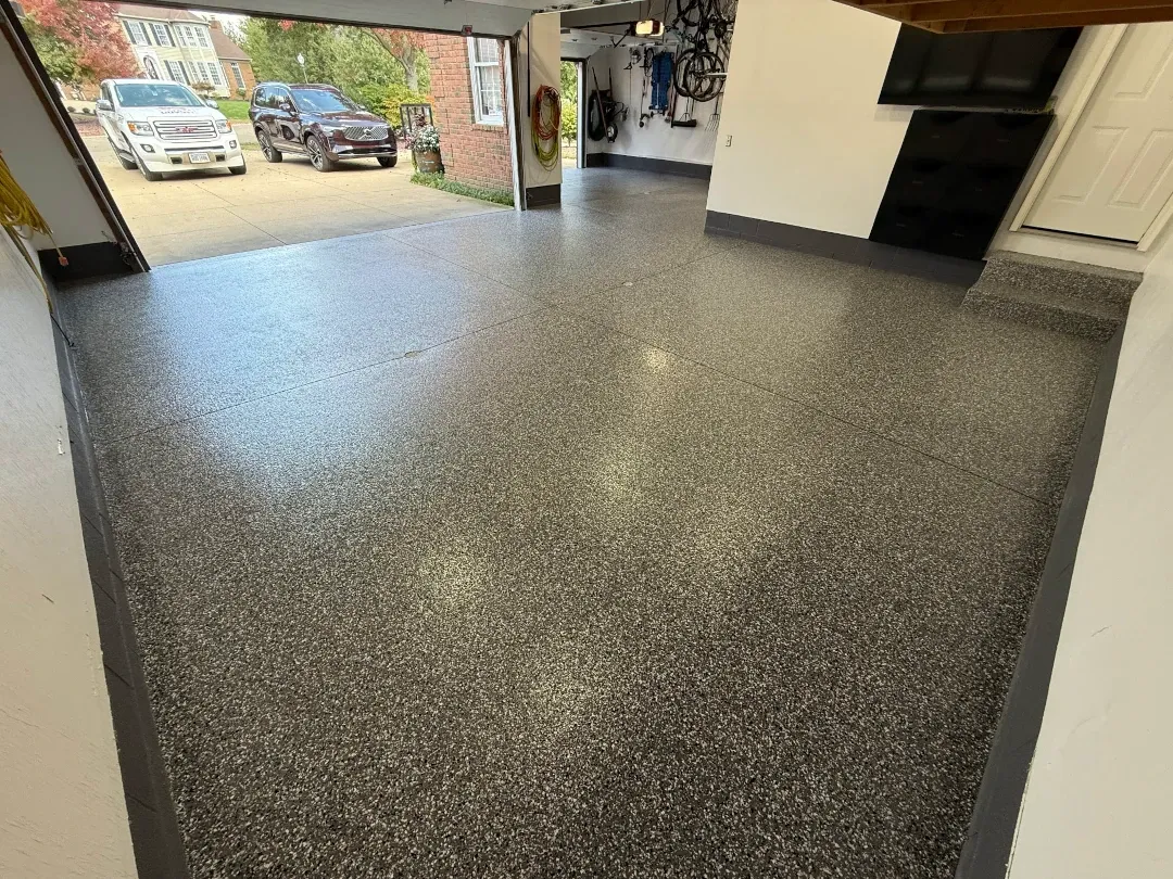 polyaspartic floor coating garage with truck outside garage door