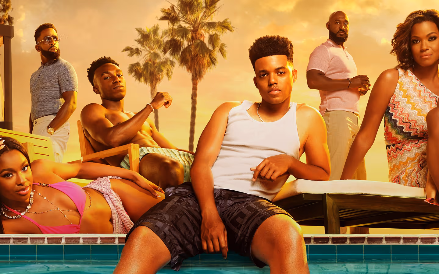Six diverse young adults relaxing by a poolside under a sunset sky with palm trees in the background.