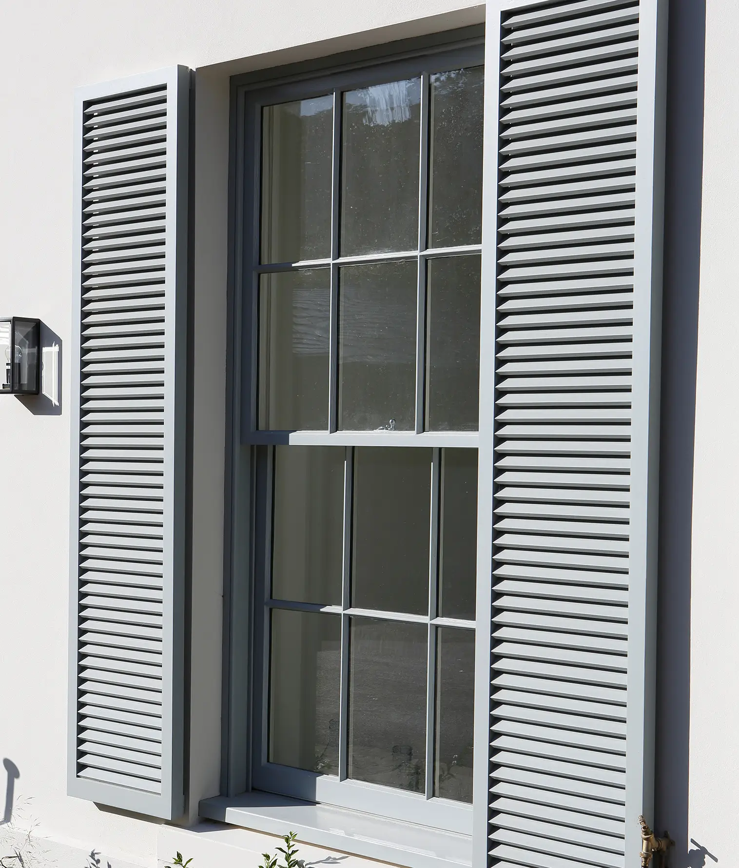 close-up of timber window and shutters for refurbished time in Surrey