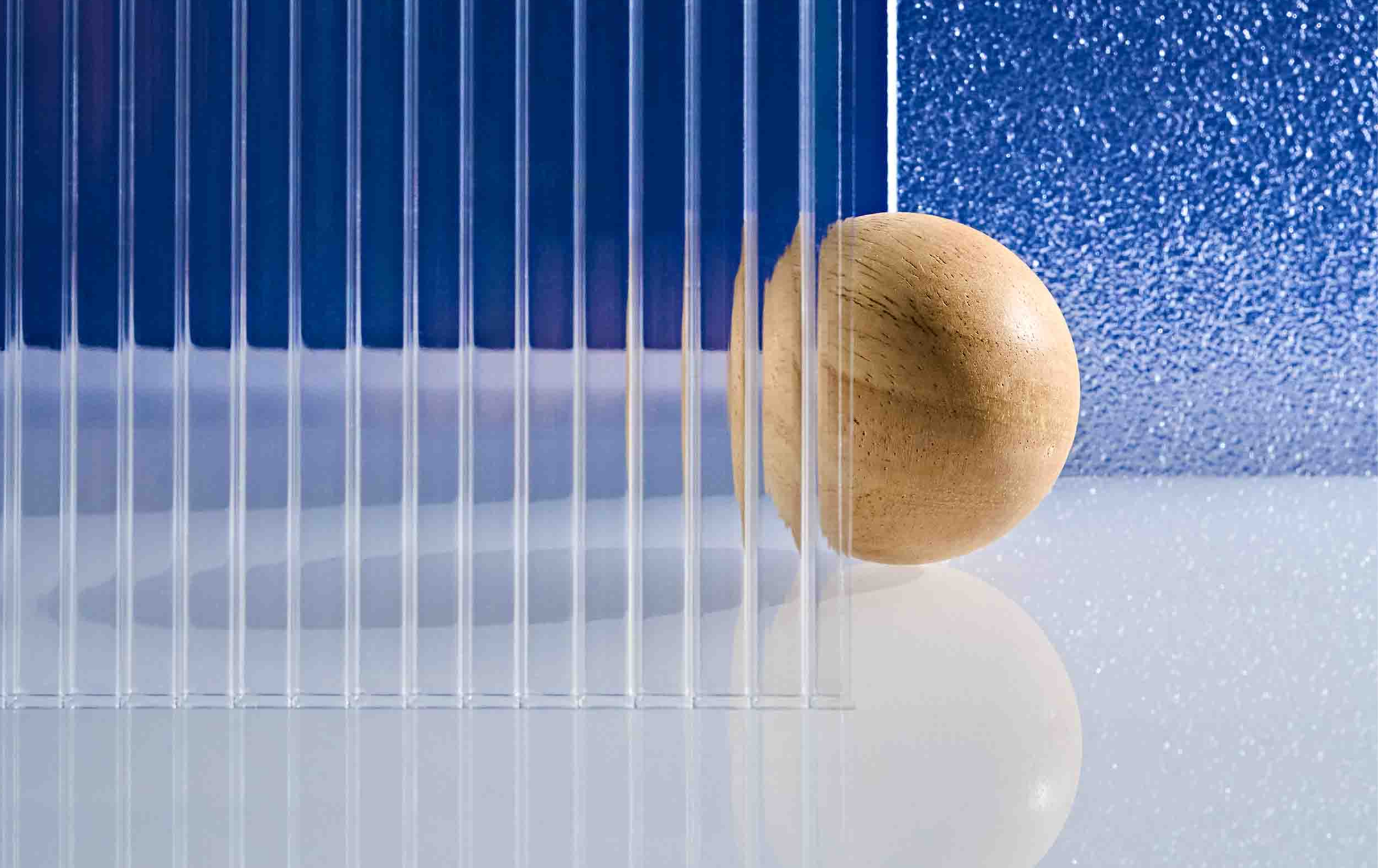 wooden ball on blue water background