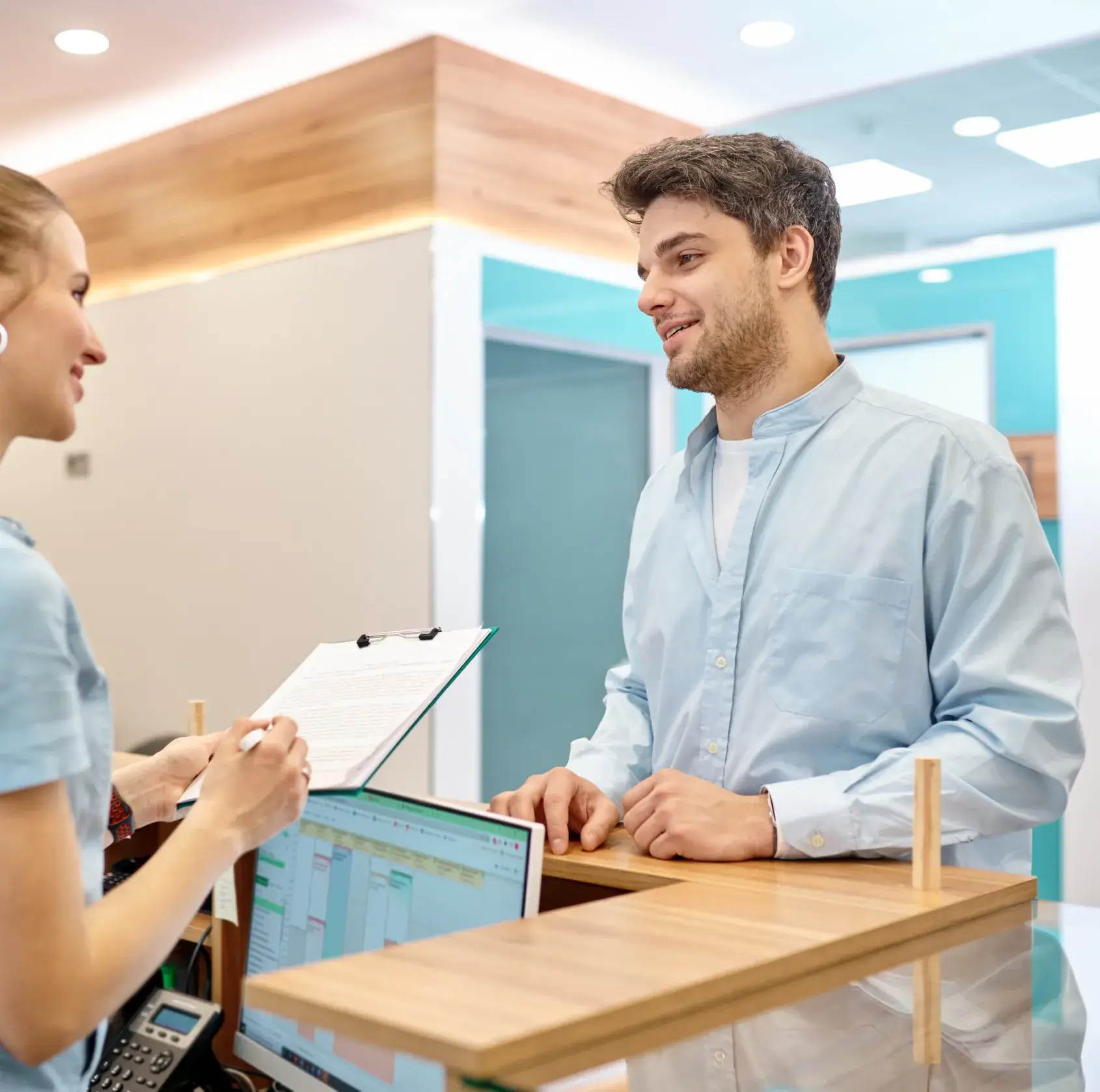 staff attending man at the frontdesk