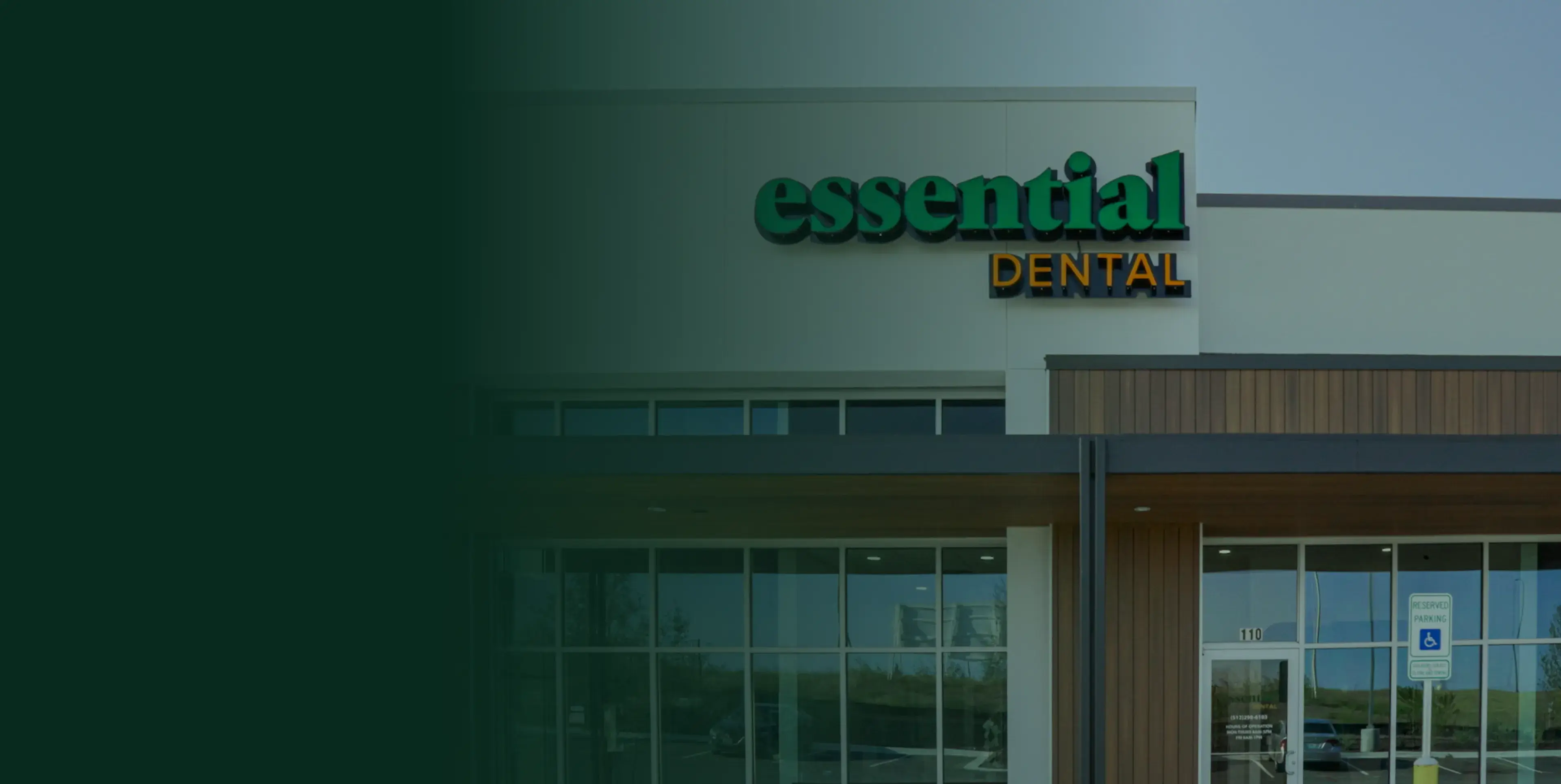 The image shows the entrance to a dental clinic featuring the sign "Essential Dental."
