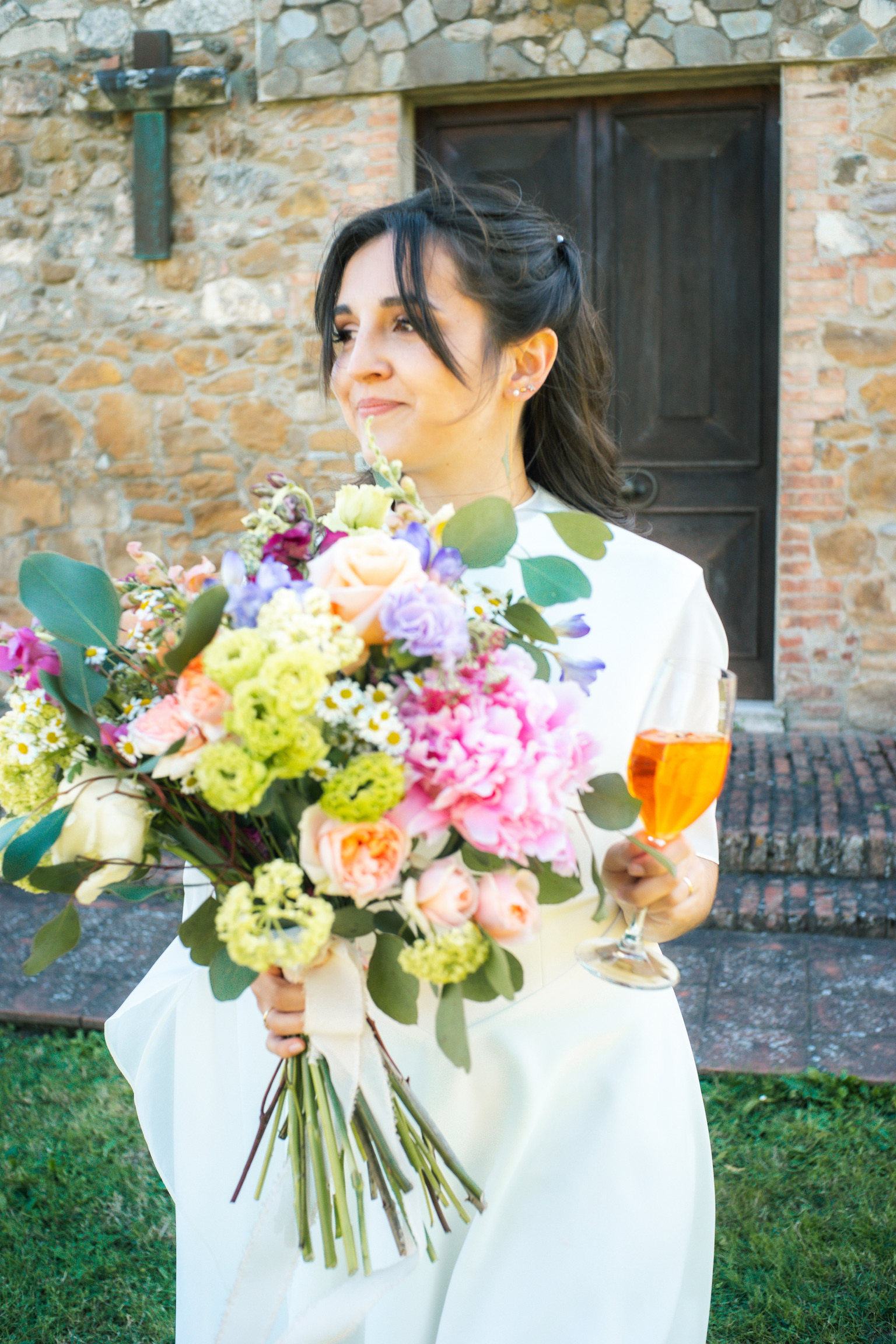 a woman holding a bouquet of flowers