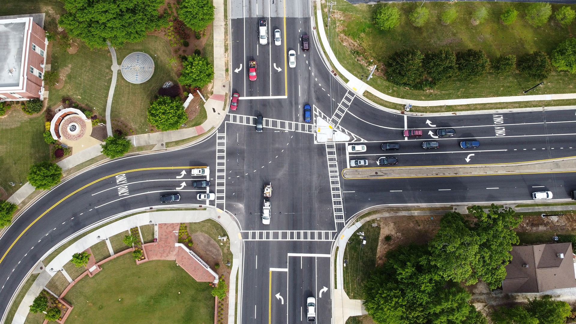 High-visibility crosswalk and approach markings near entries