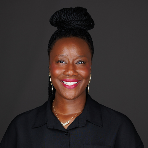 Man wearing blue suit blazer and button up shirt.