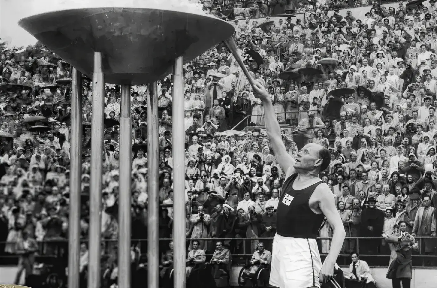 Image of the Olympic torch being lit