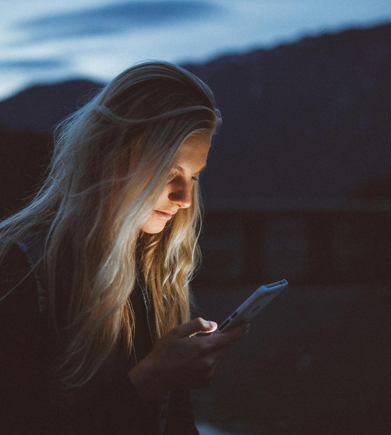 Woman holding phone.
