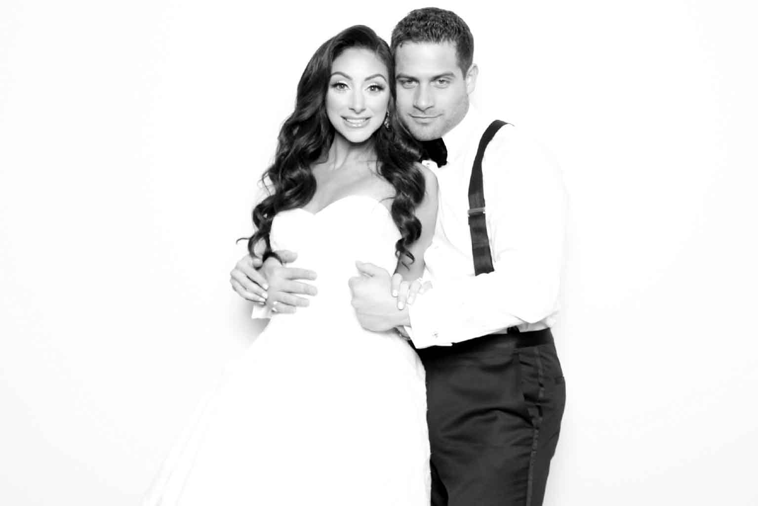 Elegant black and white glam portrait of a couple at a luxury Miami wedding, captured by the Lux Photo Booth’s high-contrast studio lighting.