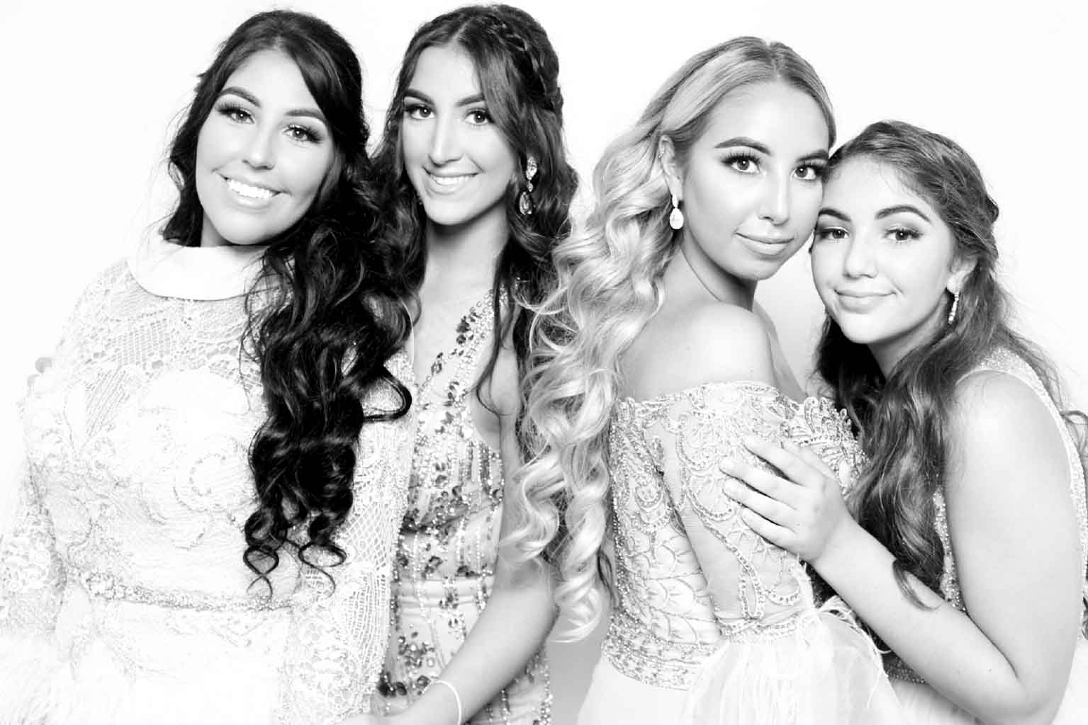 Teens posing at a Bar/Bat Mitzvah celebration in Miami, captured in black and white by the Roaming Photo Booth for a modern, high-style keepsake.