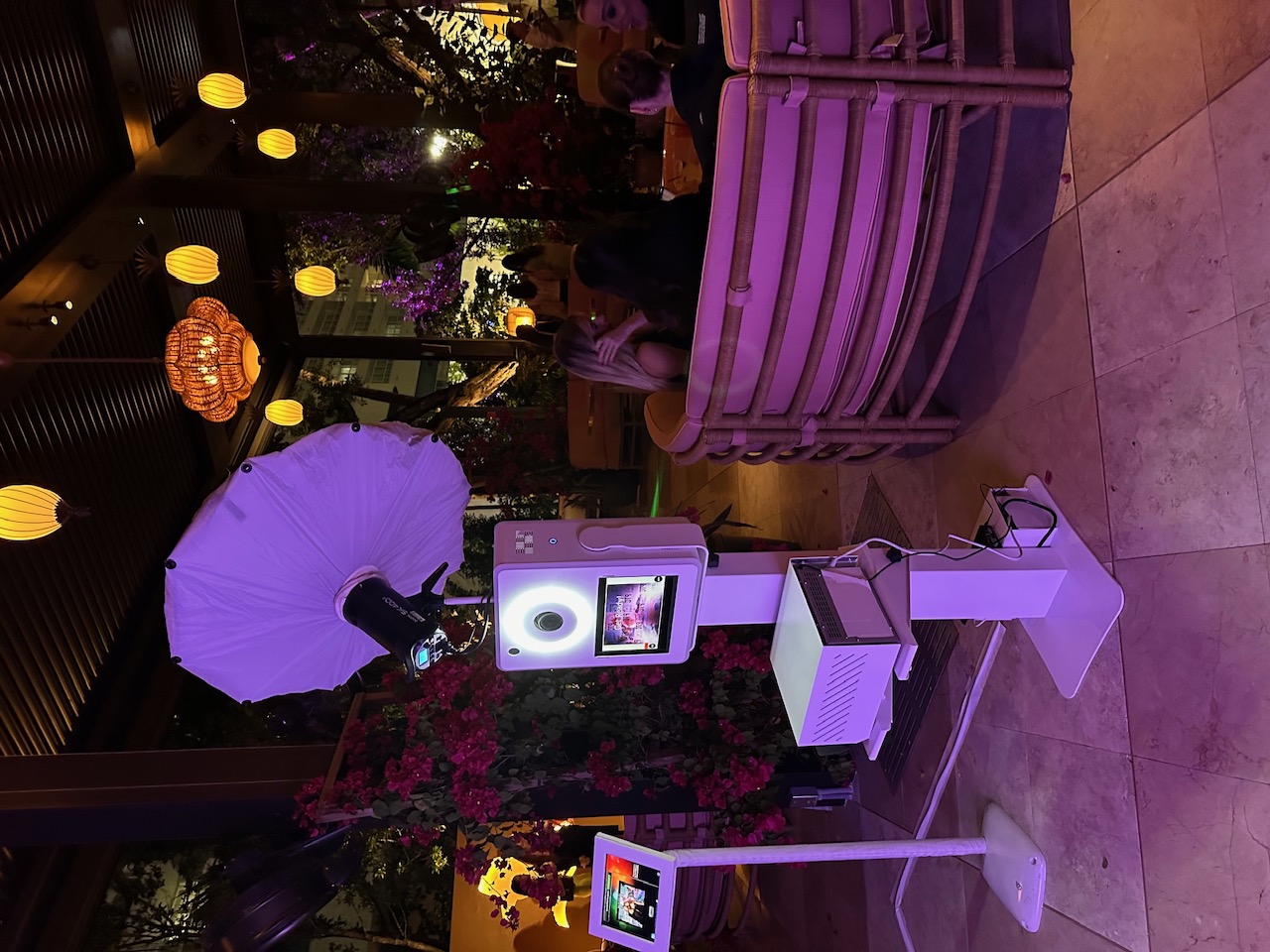 Guests using a roaming and fixed photo booth setup at a Florida event