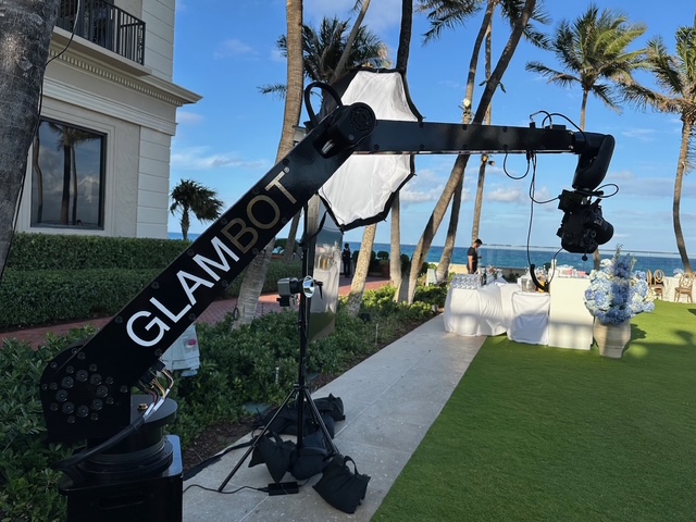 GlamBot capturing a guest in cinematic slow-motion video at a Miami event