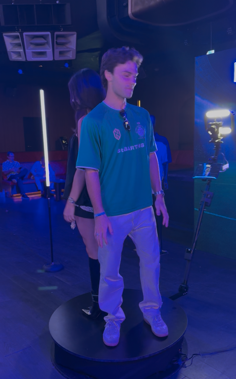 Guest on the 360 photo booth rotating platform at the Nautica brand activation inside DAER Nightclub in Hollywood, Florida
