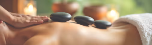 Woman getting a hot stone massage
