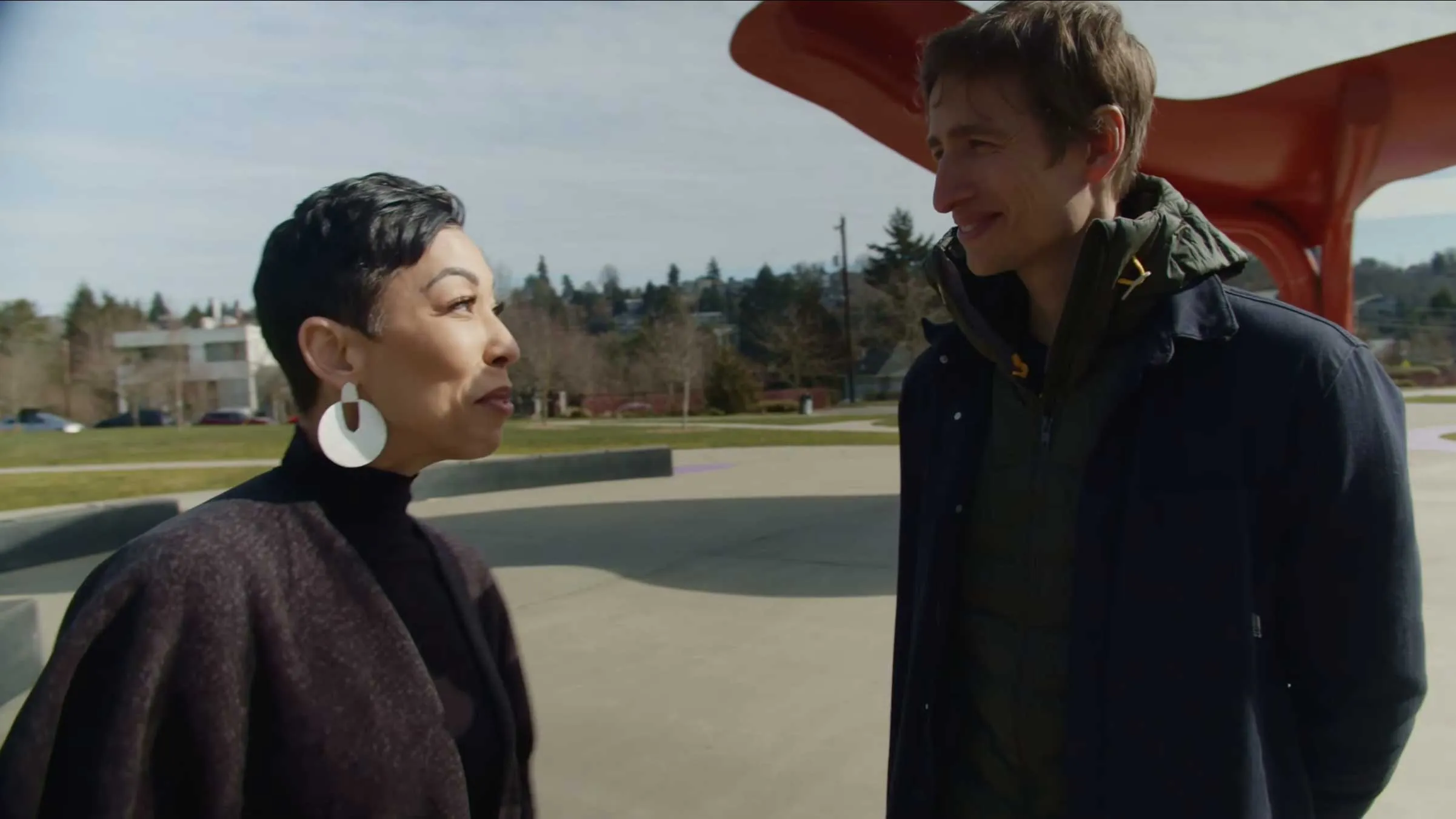picture of a woman and man talking outside