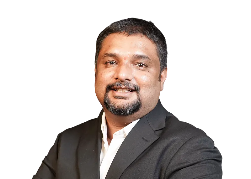 Smiling man with short dark hair and goatee wearing a black blazer and white shirt