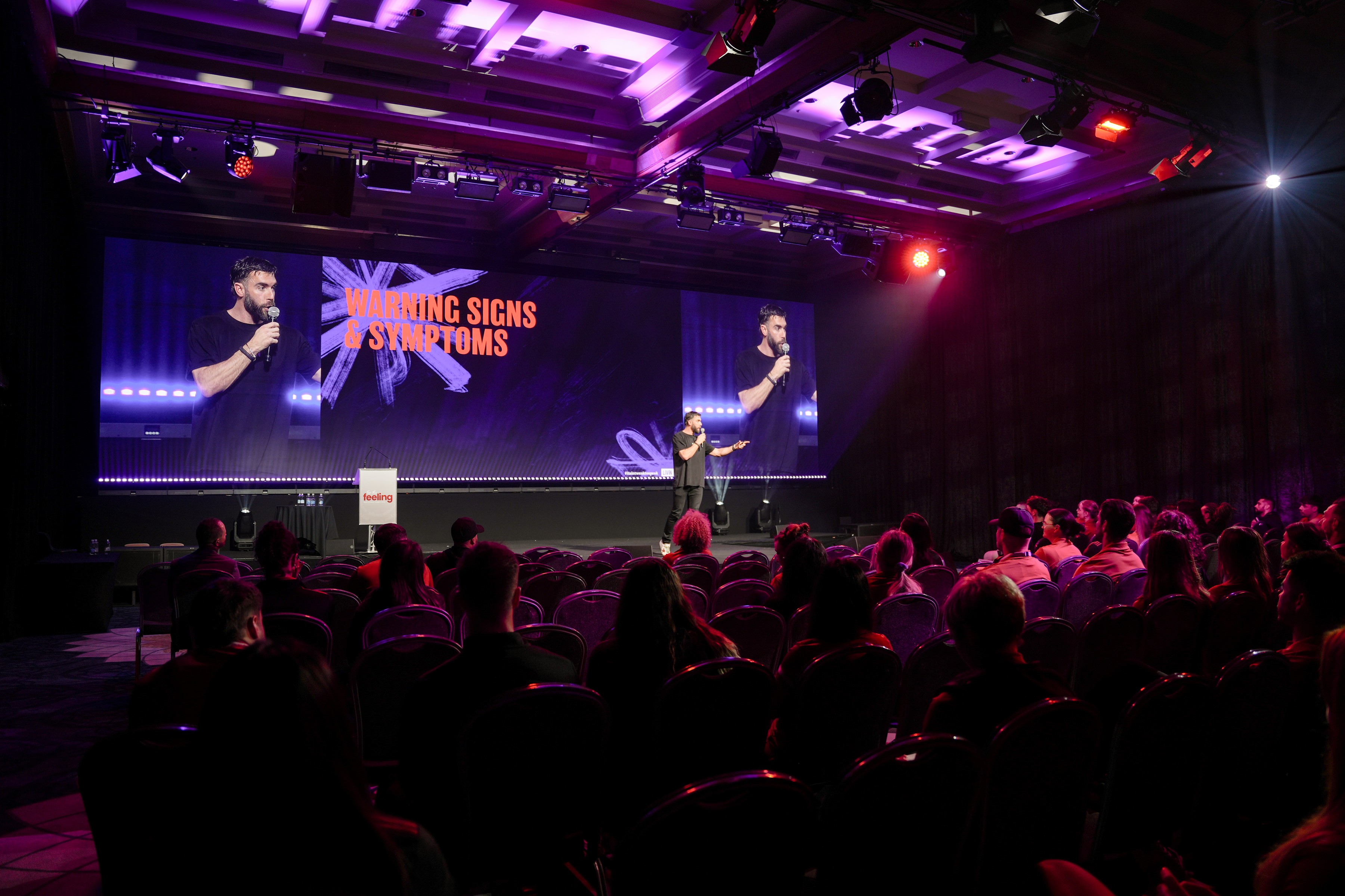 A packed room listening to Luke Foster speak