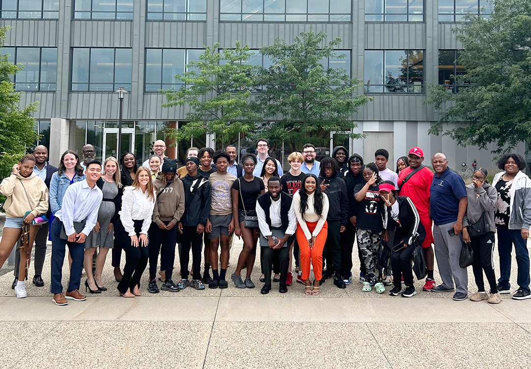 Group photo of Boys and Girls Club students and FS employees in front of the FS Philadelphia office.