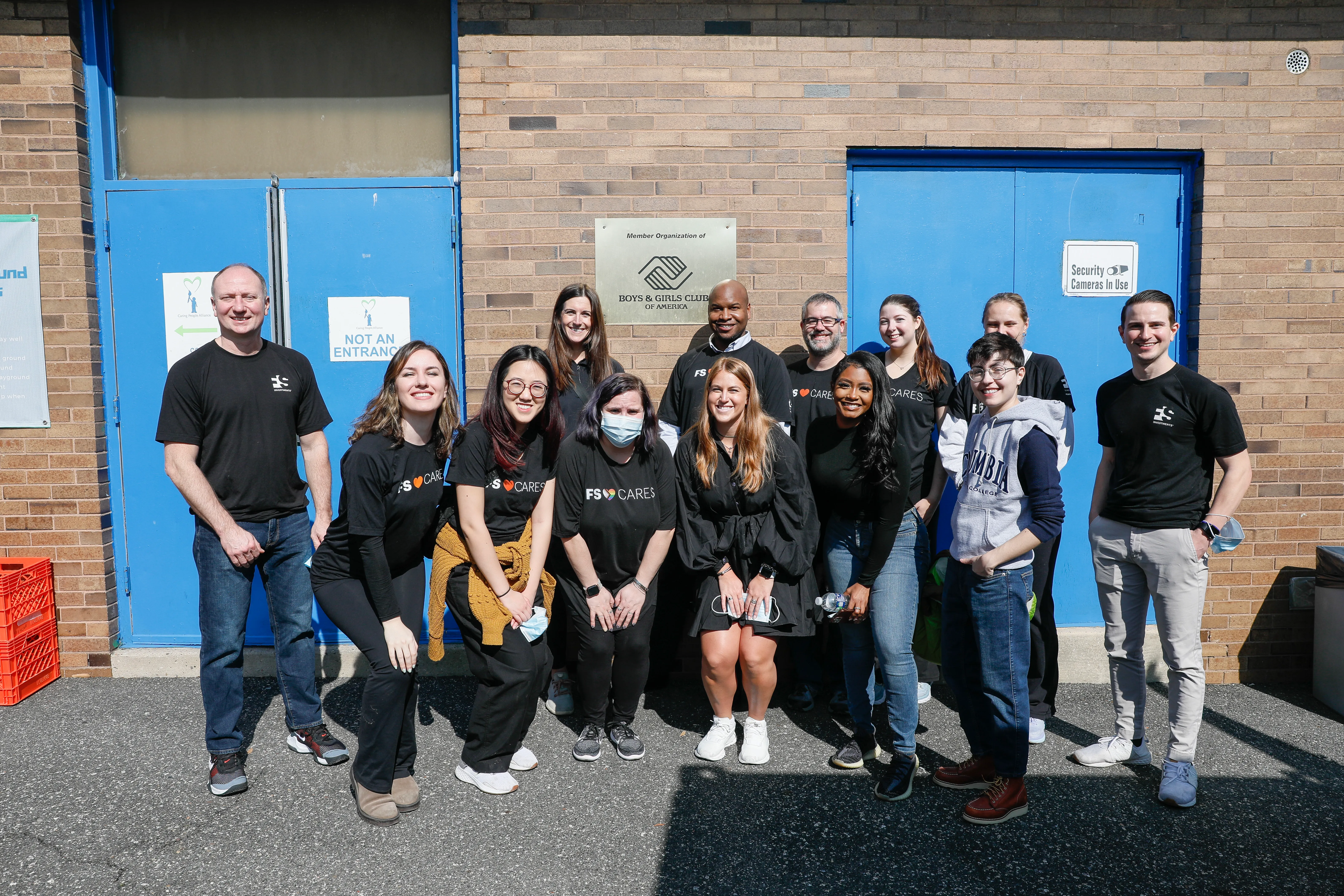 Group photo of FS volunteers outside of the Boys & Girls Clubs building.