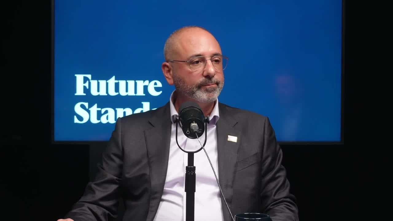 Rob Lawrence speaks into a microphone during a Future Standard podcast recording.