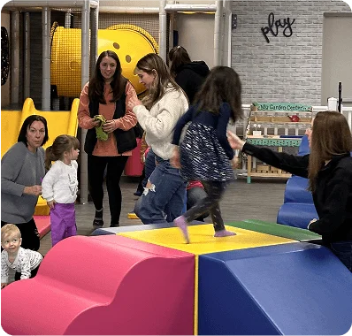 An image of children playing with soft play equipment