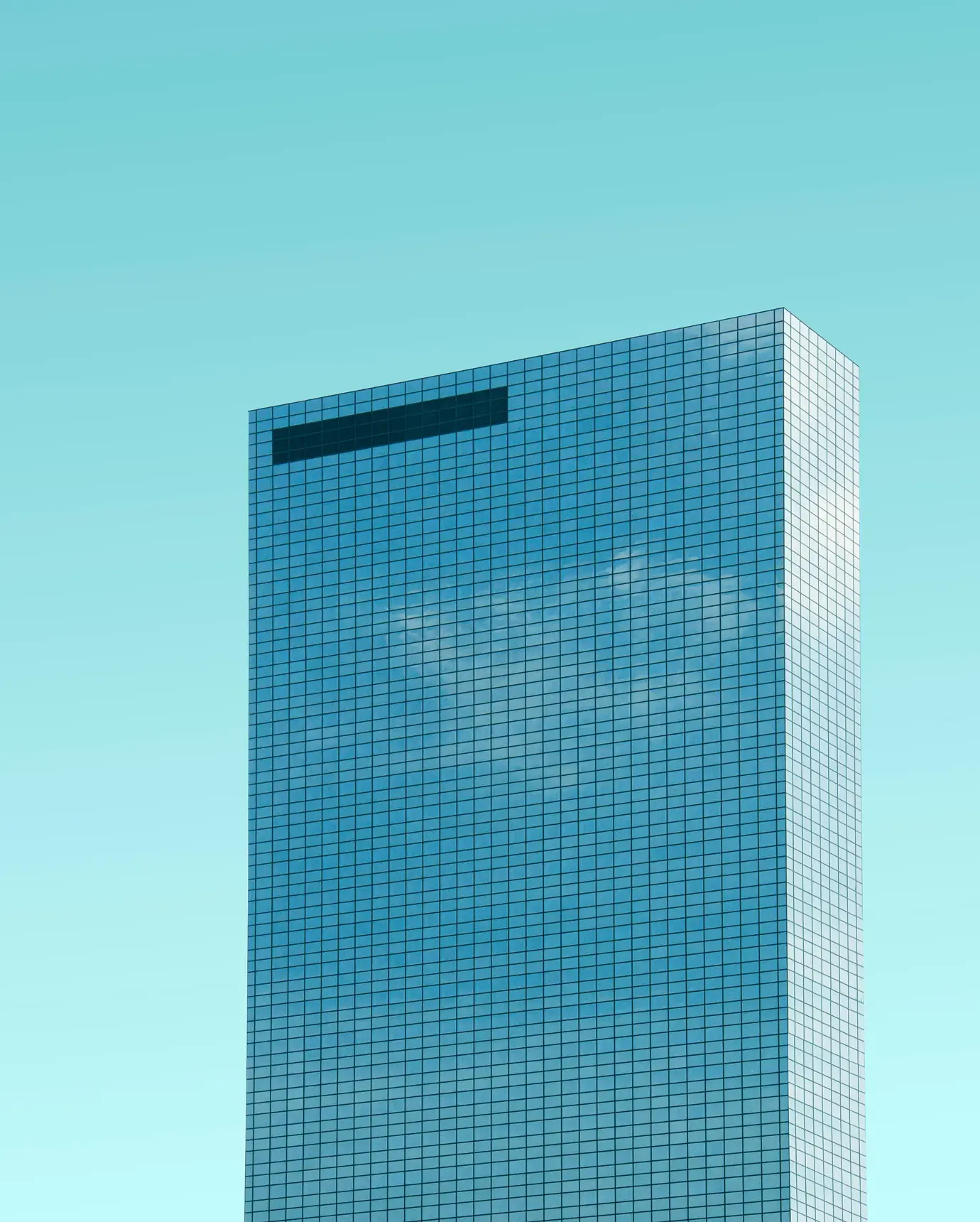 A tall building with a sky background.